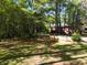 Landscaped side yard with a view of the house at 5618 Highway 212, Covington, GA 30016