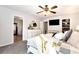 Main bedroom with ceiling fan, large dresser, and ensuite bathroom access at 9154 Branch Valley Way, Roswell, GA 30076