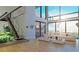 Bright living room with large windows, hardwood floors, and a staircase at 1103 Lynmoor Ne Dr, Brookhaven, GA 30319