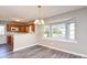 Kitchen dining area with bay window and hardwood floors at 6315 Wellington Walk Way, Lithonia, GA 30058