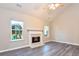 Bright living room features a fireplace, hardwood floors, and neutral walls at 6315 Wellington Walk Way, Lithonia, GA 30058