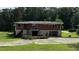 Back of brick ranch house with stone foundation at 539 Lynhurst Sw Dr, Atlanta, GA 30311