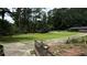 Large grassy yard with driveway and mature trees at 539 Lynhurst Sw Dr, Atlanta, GA 30311