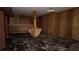 Unfinished basement featuring a built-in bar and wood paneling at 539 Lynhurst Sw Dr, Atlanta, GA 30311