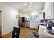 Bright kitchen boasts stainless steel appliances and white cabinets at 6677 Sunset Hills Blvd, Rex, GA 30273