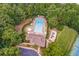 Aerial view of community pool, playground, and surrounding area at 1116 Towne Lake E Hls, Woodstock, GA 30189