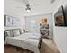 Bright bedroom with a queen-size bed, ceiling fan, and plenty of storage at 2615 Quarterdeck Dr, Cumming, GA 30041