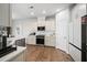 Modern kitchen with white cabinets and stainless steel appliances at 2615 Quarterdeck Dr, Cumming, GA 30041