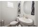 Small powder room with white vanity and fixtures at 2615 Quarterdeck Dr, Cumming, GA 30041