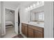 Double vanity bathroom with a large mirror at 2615 Quarterdeck Dr, Cumming, GA 30041