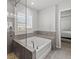 Spa-like bathroom with a soaking tub and walk-in shower at 2615 Quarterdeck Dr, Cumming, GA 30041
