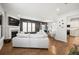 Open living space with white sofa and fireplace at 2615 Quarterdeck Dr, Cumming, GA 30041