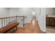 Elegant hallway with hardwood floors and a built-in bench at 2615 Quarterdeck Dr, Cumming, GA 30041