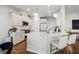 Modern kitchen with white cabinets, quartz countertops, and stainless steel appliances at 2615 Quarterdeck Dr, Cumming, GA 30041