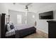 Spacious bedroom with a king-size bed and a ceiling fan at 2615 Quarterdeck Dr, Cumming, GA 30041