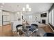 Kitchen and dining area with breakfast bar and glass dining table at 2615 Quarterdeck Dr, Cumming, GA 30041