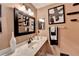 Updated bathroom with a vanity and a large mirror at 4255 Iris Brooke Ln, Snellville, GA 30039