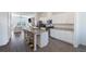 Modern kitchen with granite countertops and white cabinets at 4219 Tifton Ln, Sugar Hill, GA 30518