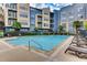 Inviting community pool with lounge chairs and surrounding landscaping at 400 17Th Nw St # 1134, Atlanta, GA 30363