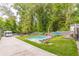 Relaxing backyard with a modern pool and grassy area at 1847 Walker Ave, College Park, GA 30337