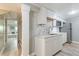 Basement kitchenette with white cabinets and marble countertops at 1847 Walker Ave, College Park, GA 30337