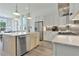 Modern kitchen with stainless steel appliances and marble countertops at 130 Rolison Way, Fayetteville, GA 30214