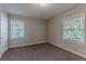 Well-lit bedroom with neutral walls and carpeted floors at 2301 Delowe Dr, Atlanta, GA 30344
