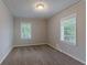 Cozy bedroom with neutral walls and carpeted floors at 2301 Delowe Dr, Atlanta, GA 30344