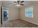 Spacious bedroom with neutral carpeting and ceiling fan at 2301 Delowe Dr, Atlanta, GA 30344