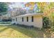 Side view of a ranch home showcasing its brick facade and landscaping at 2301 Delowe Dr, Atlanta, GA 30344