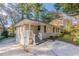 Front view of a charming ranch home with a white railing and spacious driveway at 2301 Delowe Dr, Atlanta, GA 30344