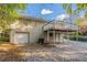 Back of house showing garage, deck, and backyard at 2301 Delowe Dr, Atlanta, GA 30344