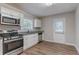 Modern kitchen with stainless steel appliances and granite countertops at 2301 Delowe Dr, Atlanta, GA 30344