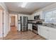 Open kitchen with stainless steel appliances and granite countertops at 2301 Delowe Dr, Atlanta, GA 30344