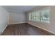Bright living room features hardwood floors and large windows at 2301 Delowe Dr, Atlanta, GA 30344