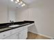 Bathroom with white cabinets and dark countertop at 3900 Riverlook Se Pkwy # 207, Marietta, GA 30067