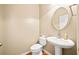 Convenient powder room with pedestal sink and toilet at 116 Market Ln, Canton, GA 30114