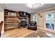 Living room with a stone fireplace and wood accent wall at 4364 Saddlecreek Ct, Auburn, GA 30011