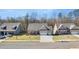 Three-story homes in a neighborhood setting with lush green lawns at 63 Black Rock Rdg, Sharpsburg, GA 30277