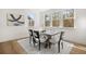 Bright dining room with hardwood floors and large windows at 63 Black Rock Rdg, Sharpsburg, GA 30277