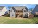 Two-story house with gray siding, wooden deck, and stairs at 63 Black Rock Rdg, Sharpsburg, GA 30277