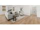 Light and airy living room with hardwood floors and access to laundry at 63 Black Rock Rdg, Sharpsburg, GA 30277