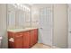 Clean bathroom with wood vanity and updated fixtures at 4248 River Green Nw Dr # 310, Atlanta, GA 30327