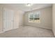 Bedroom with neutral walls and carpet flooring at 902 Callee Dr, Loganville, GA 30052