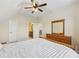Large main bedroom with vaulted ceiling, ceiling fan, and a view of the en suite bathroom at 2420 Bronze Ct, Cumming, GA 30041