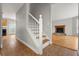 Welcoming foyer with tile flooring, a staircase, and views of the living room at 4065 Keheley Glen Ne Dr, Marietta, GA 30066