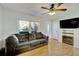 Living Room with hardwood floors, fireplace and ceiling fan at 197 Dixboro Dr, Jonesboro, GA 30238