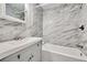 Updated bathroom featuring a bathtub and marble tile at 197 Dixboro Dr, Jonesboro, GA 30238