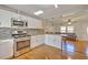 Open concept kitchen with island and stainless steel appliances at 197 Dixboro Dr, Jonesboro, GA 30238