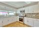 Kitchen with granite countertops and white cabinets at 197 Dixboro Dr, Jonesboro, GA 30238